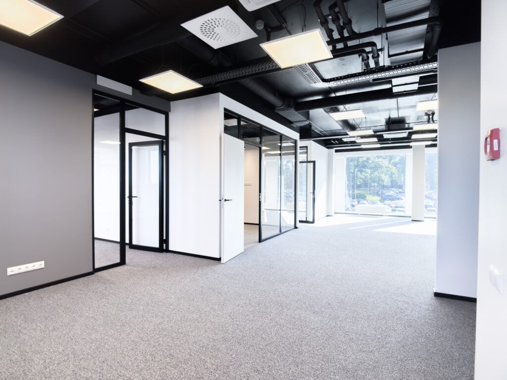 Modern empty office space with glass partitions