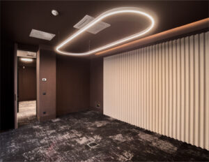 Modern room with unique ceiling lighting design.