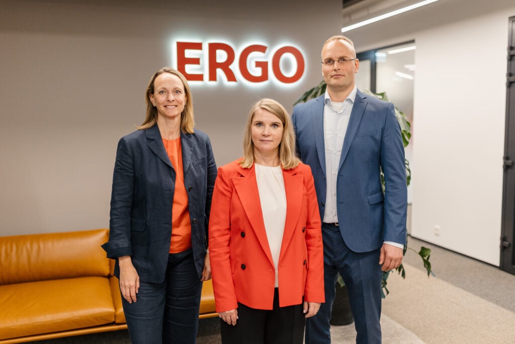 Three people standing in ERGO office.