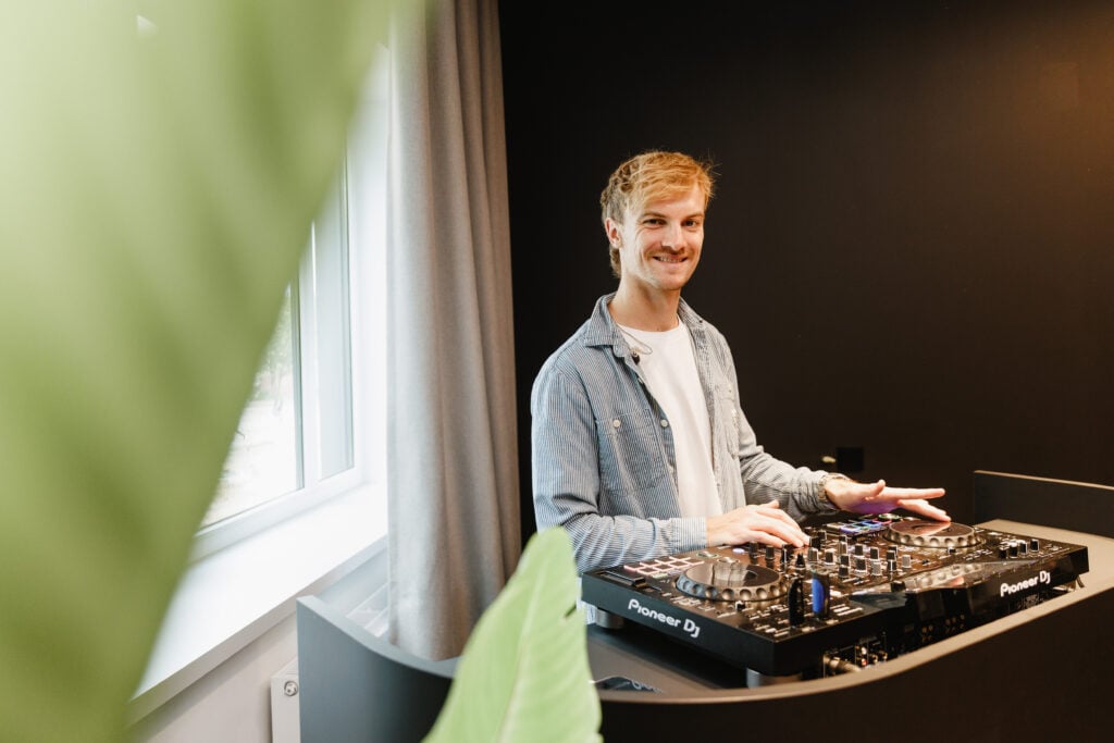DJ playing music at a mixing console