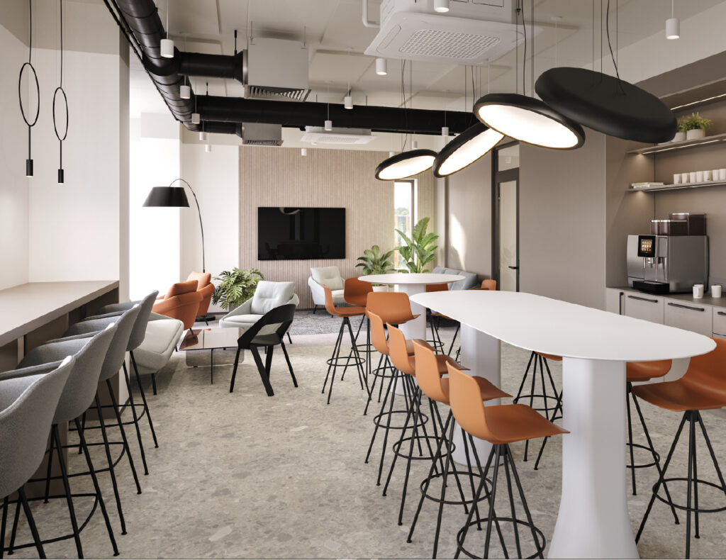 Modern office lounge with chairs and tables.