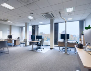 Modern office with desks and computers.