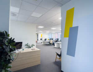 Modern open office with desks and computers