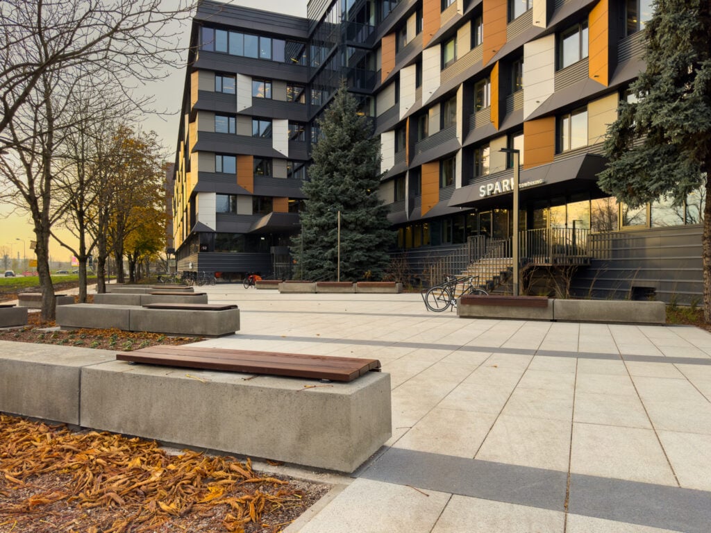 Modern office building with outdoor seating area.