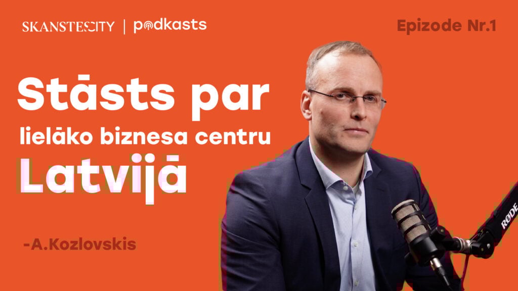 Man speaking into microphone, orange background.