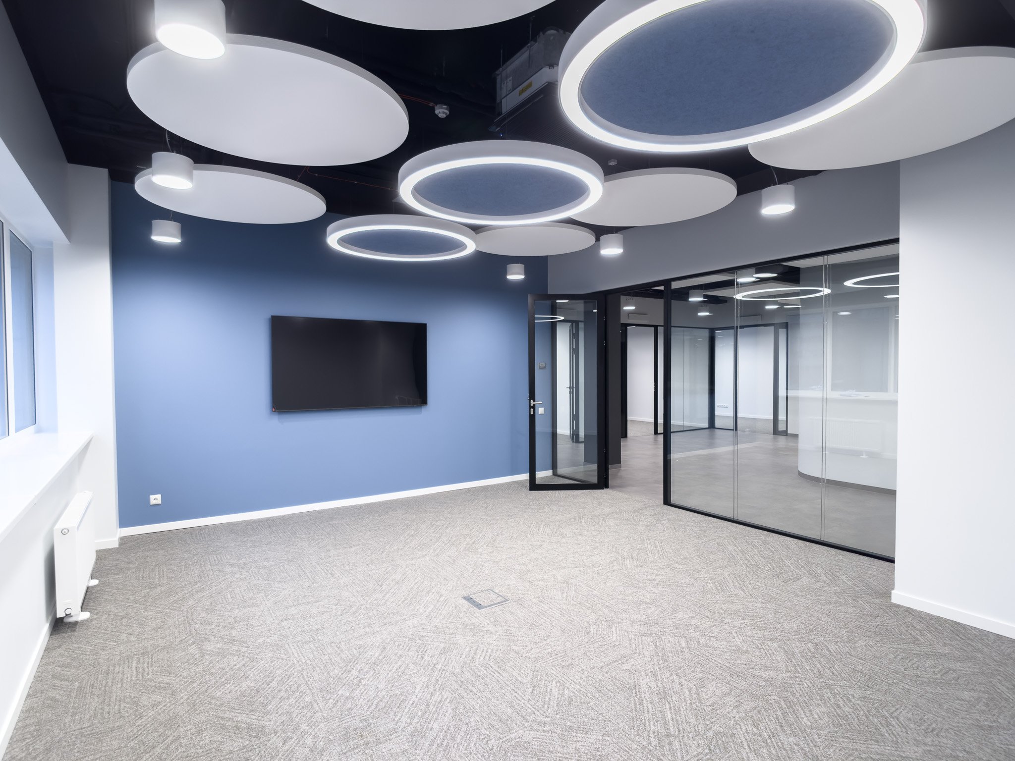 Modern office space with circular ceiling lights