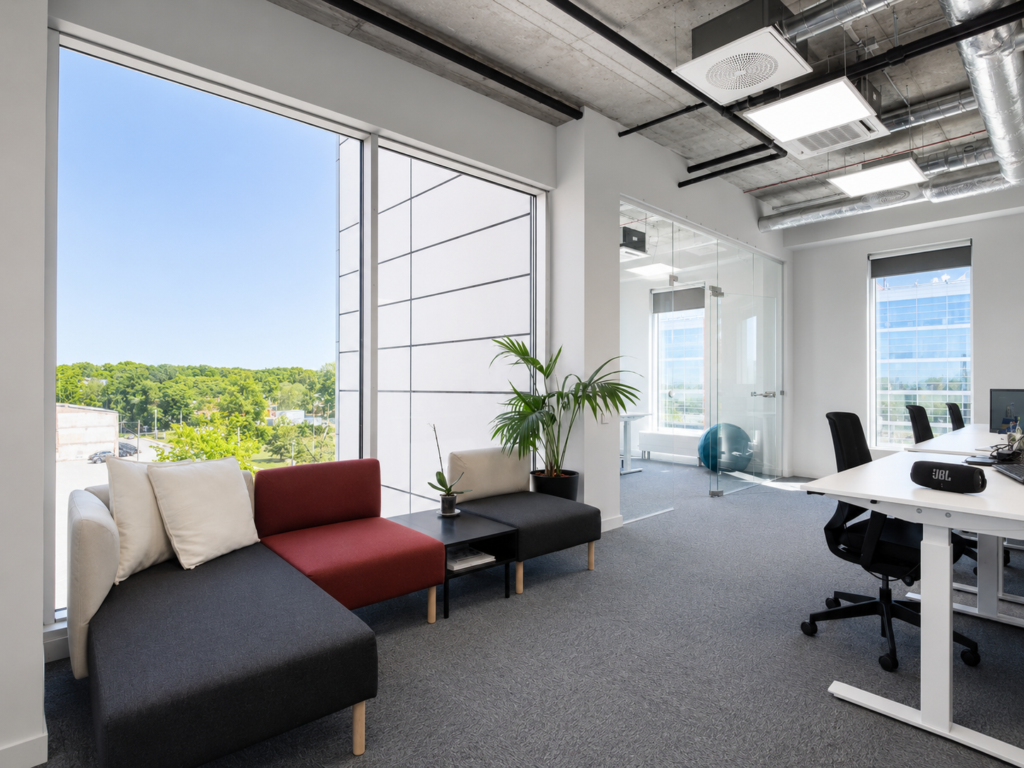 Modern office interior with large windows and seating