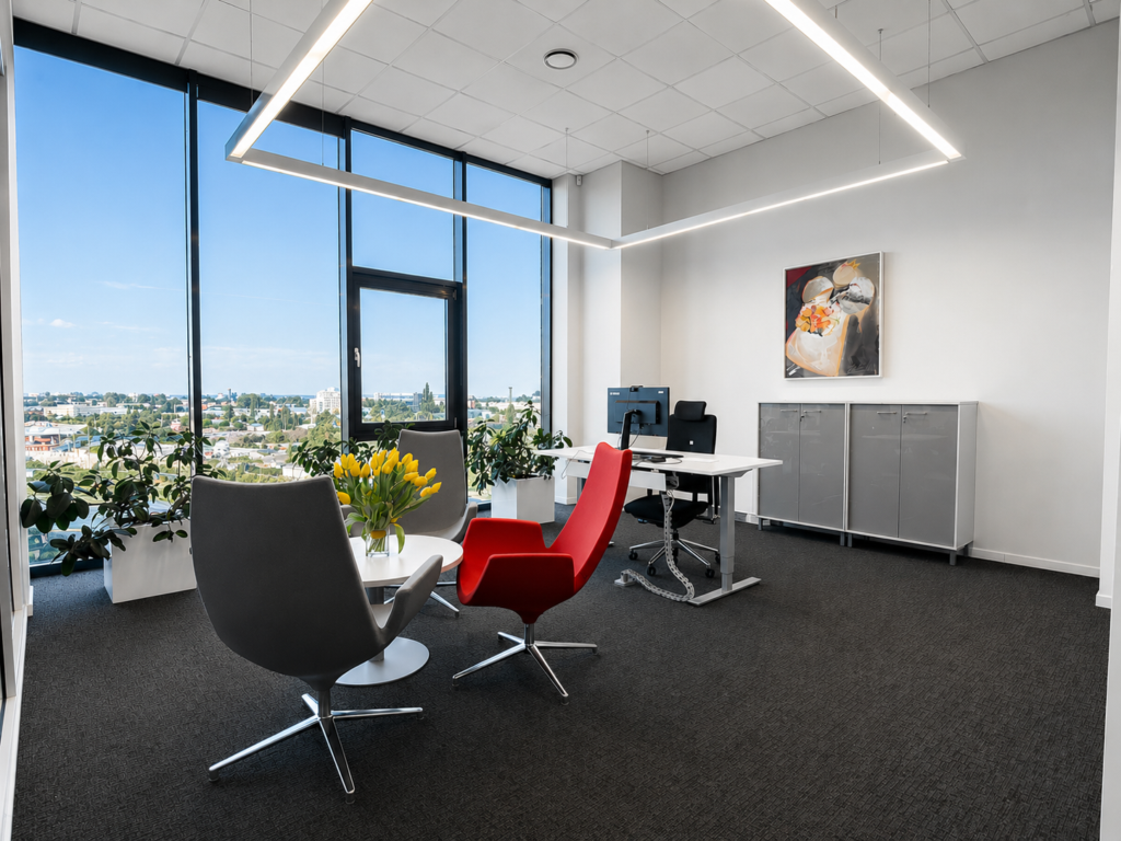 Modern office with large windows and red chair