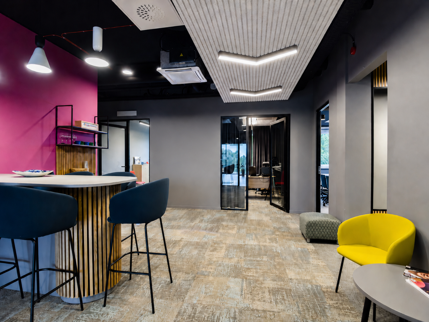 Modern office lounge with colorful walls and seating
