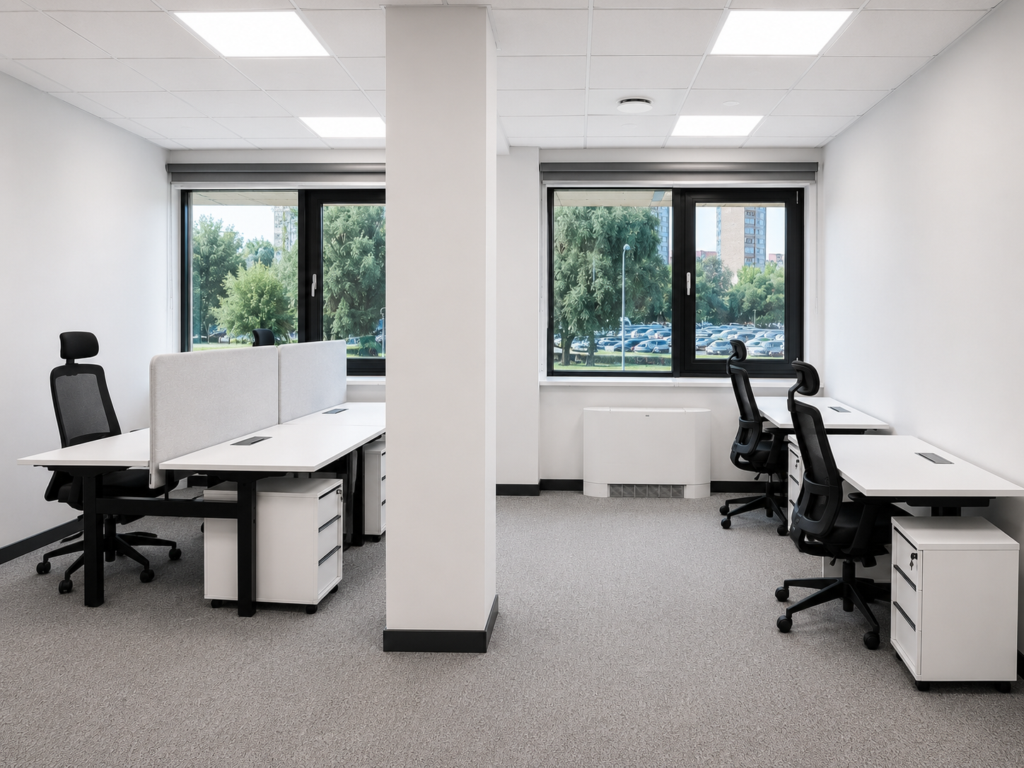 Bright modern office with desks, chairs, and large windows